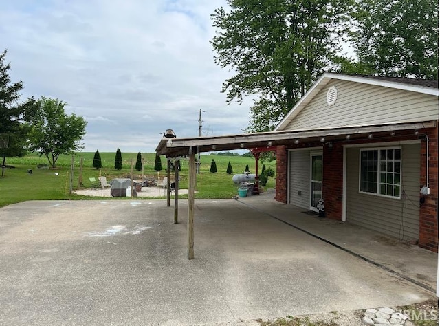 3165 E 300 S Rd, Washington, IN 47501 - exterior space featuring an attached carport and grilling area