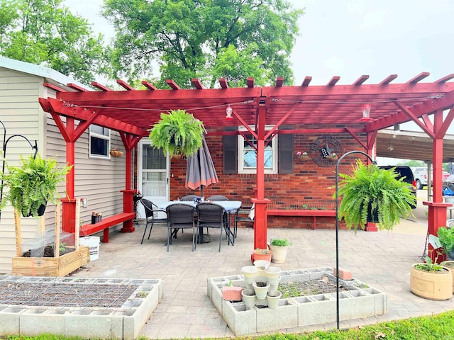 3165 E 300 S Rd, Washington, IN 47501 - view of patio / terrace featuring a garden, outdoor dining space, and a pergola