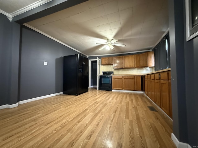 204 S Railroad Ln, Oaktown, IN 47561 - kitchen featuring black appliances, ornamental molding, brown cabinets, light wood-style floors, and a ceiling fan