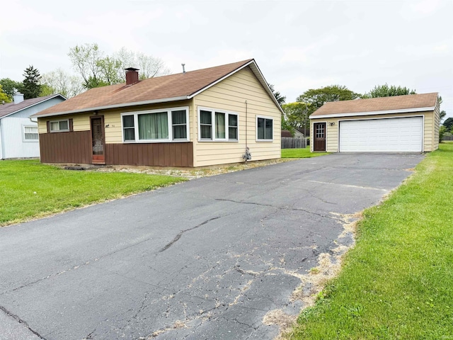 910 Brookdale Dr, New Haven, IN 46774 - view of front of property with a front lawn, a garage, and a chimney