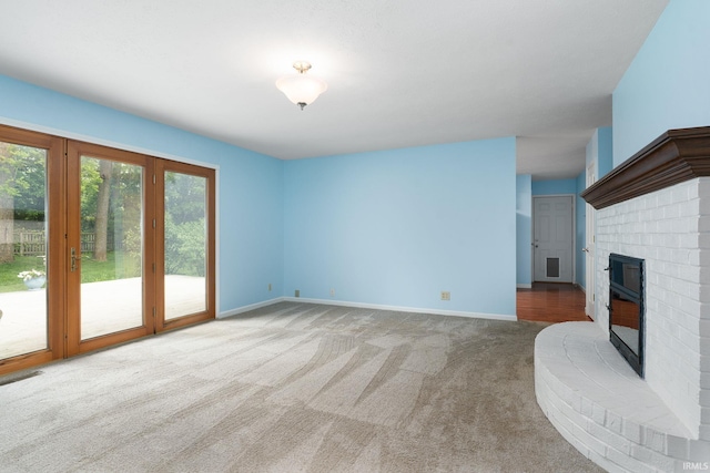 1804 Bent Tree Trl, West Lafayette, IN 47906 - unfurnished living room with carpet, plenty of natural light, a fireplace, and baseboards
