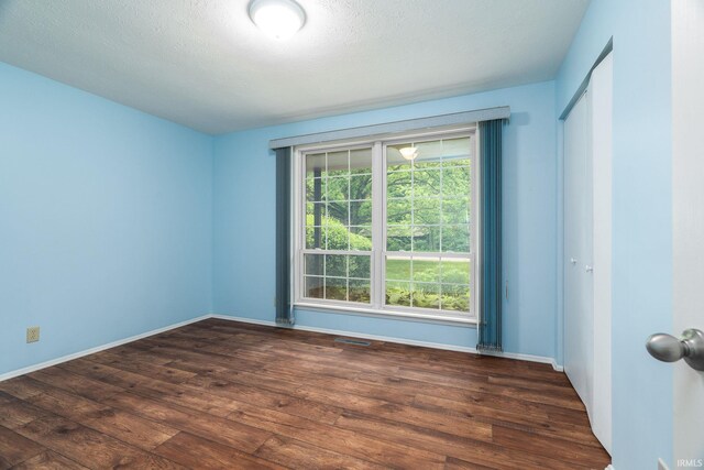 1804 Bent Tree Trl, West Lafayette, IN 47906 - spare room featuring wood-type flooring, a textured ceiling, and baseboards