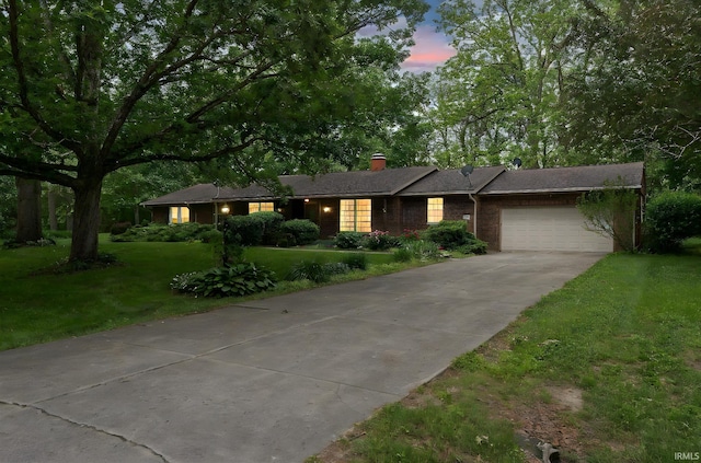 1804 Bent Tree Trl, West Lafayette, IN 47906 - single story home with an attached garage, concrete driveway, a lawn, a chimney, and brick siding