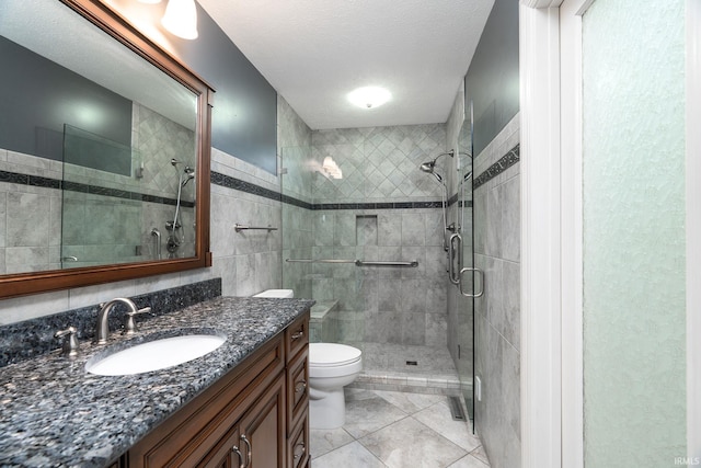 1804 Bent Tree Trl, West Lafayette, IN 47906 - bathroom featuring toilet, a stall shower, vanity, tile walls, and tile patterned floors