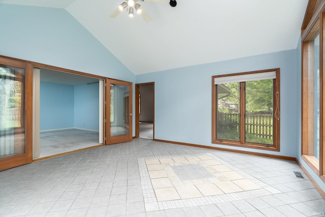 1804 Bent Tree Trl, West Lafayette, IN 47906 - unfurnished room with baseboards, ceiling fan, light tile patterned floors, light colored carpet, and high vaulted ceiling