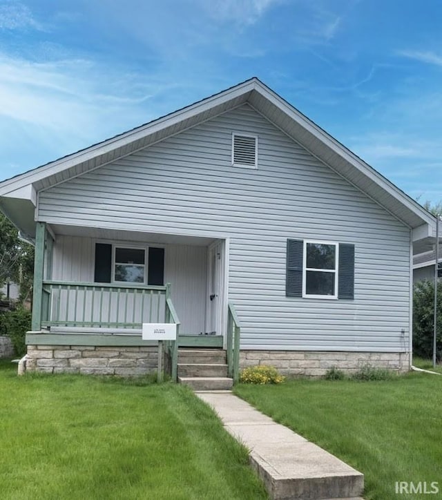 504 V St, Bedford, IN 47421 - view of front of house featuring a front yard and a porch