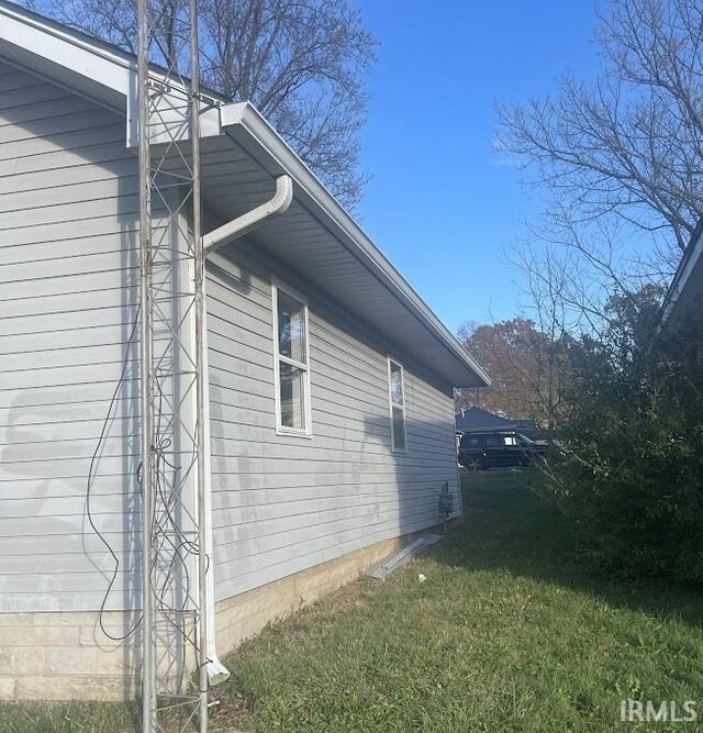 504 V St, Bedford, IN 47421 - view of home's exterior with a yard