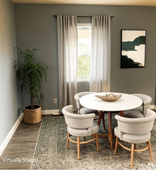 504 V St, Bedford, IN 47421 - dining room featuring baseboards and wood finished floors