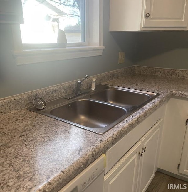 504 V St, Bedford, IN 47421 - kitchen view of a sink, white cabinets, and white dishwasher