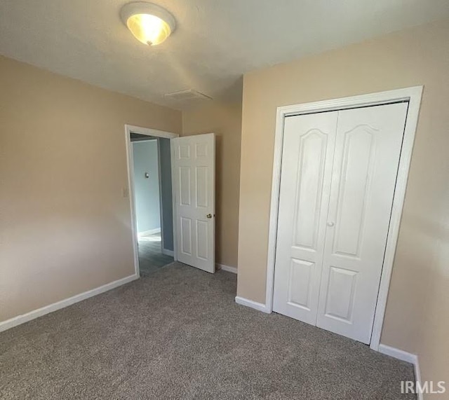 504 V St, Bedford, IN 47421 - unfurnished bedroom with carpet flooring, baseboards, and a closet