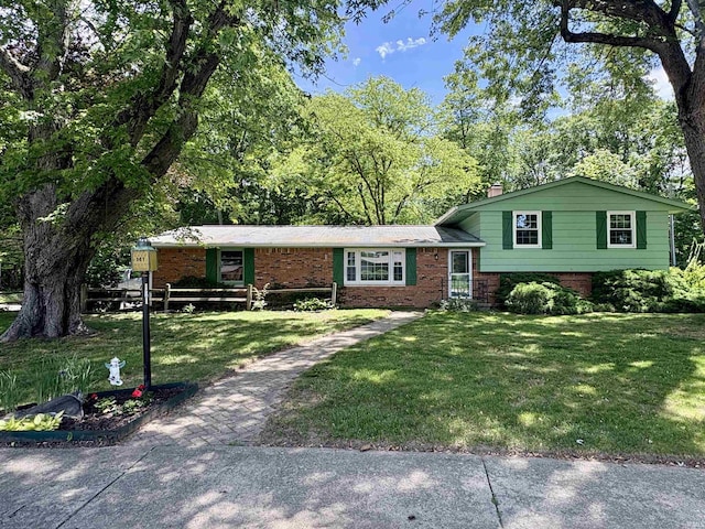 141 Indian Rock Dr, West Lafayette, IN 47906 - split level home featuring brick siding, a front lawn, and a chimney