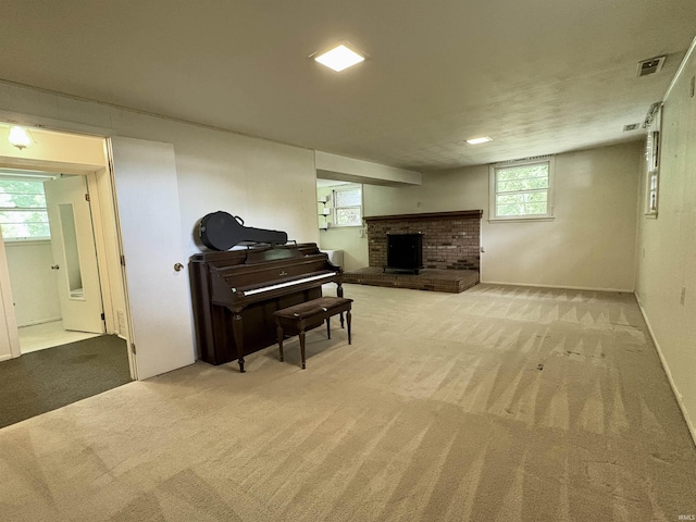 141 Indian Rock Dr, West Lafayette, IN 47906 - sitting room featuring light carpet, a fireplace, and baseboards