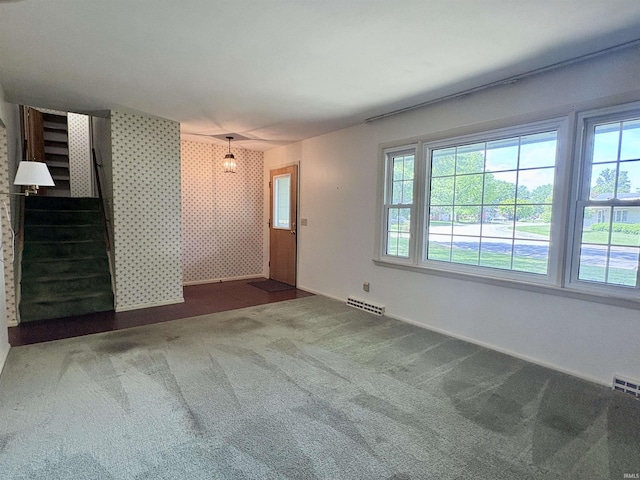 141 Indian Rock Dr, West Lafayette, IN 47906 - unfurnished living room with stairs, carpet, and baseboards