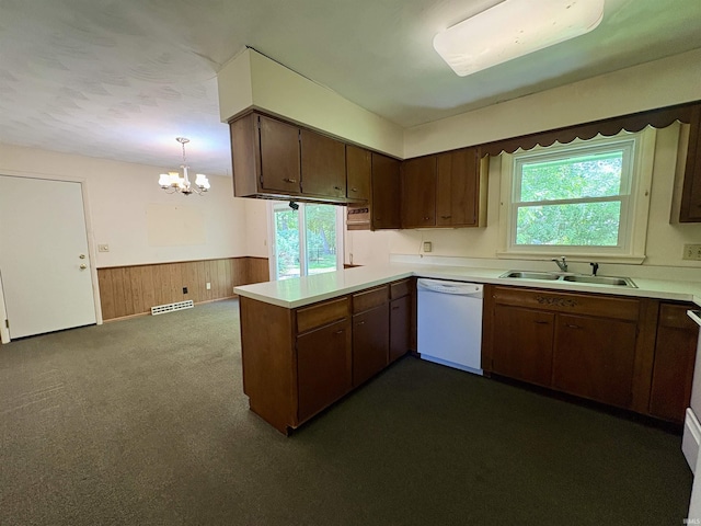 141 Indian Rock Dr, West Lafayette, IN 47906 - kitchen featuring dishwasher, a sink, a chandelier, wainscoting, and a peninsula