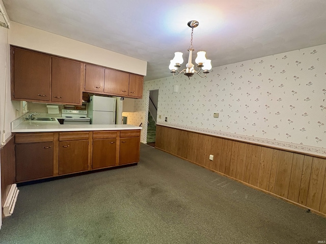 141 Indian Rock Dr, West Lafayette, IN 47906 - kitchen featuring wallpapered walls, white appliances, wainscoting, a chandelier, and a sink