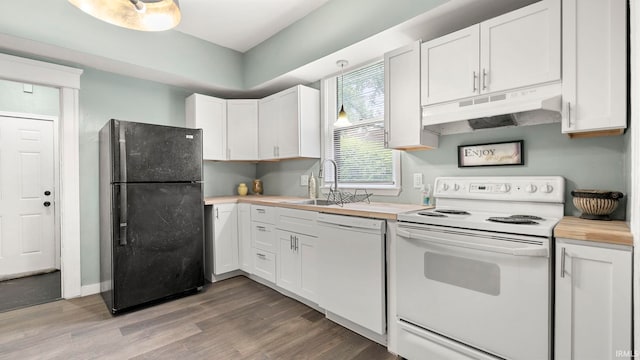 1018 Loree St, Fort Wayne, IN 46805 - kitchen featuring white appliances, under cabinet range hood, a sink, wood finished floors, and white cabinets
