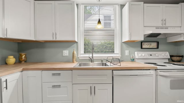 1018 Loree St, Fort Wayne, IN 46805 - kitchen with white appliances, under cabinet range hood, a sink, and butcher block counters