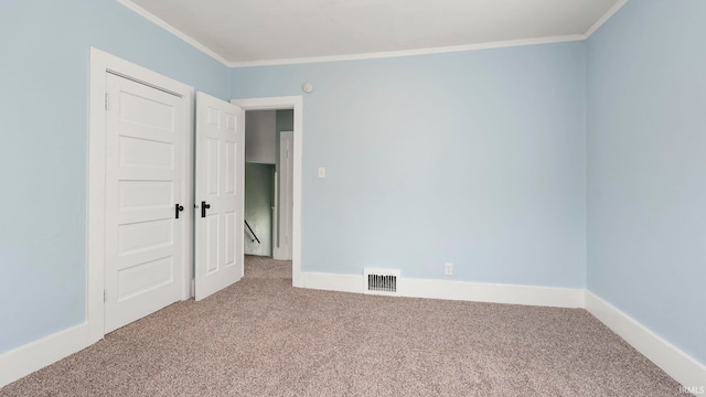 1018 Loree St, Fort Wayne, IN 46805 - carpeted empty room featuring crown molding and baseboards