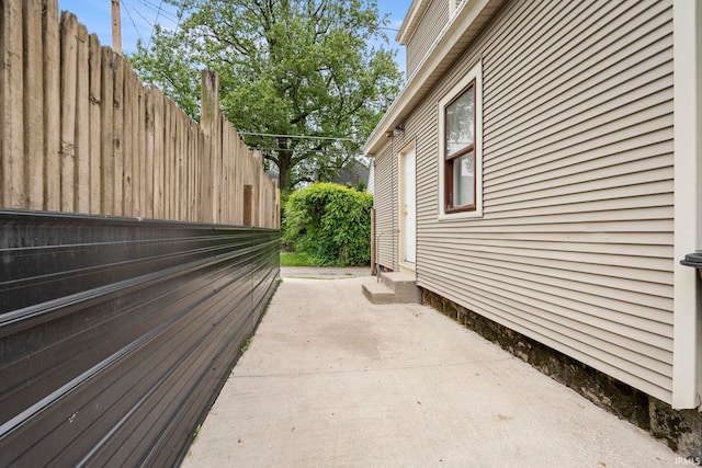 1018 Loree St, Fort Wayne, IN 46805 - view of side of property featuring entry steps and a patio area