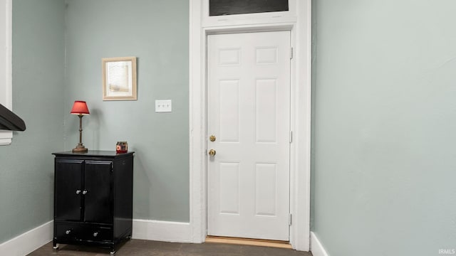 1018 Loree St, Fort Wayne, IN 46805 - entryway with baseboards and dark wood finished floors