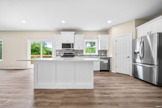 2416 S Woodland Trl, Warsaw, IN 46580 - kitchen with stainless steel appliances, light countertops, white cabinets, and recessed lighting