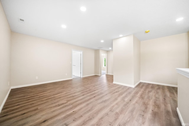 2416 S Woodland Trl, Warsaw, IN 46580 - spare room with recessed lighting, wood finished floors, and baseboards