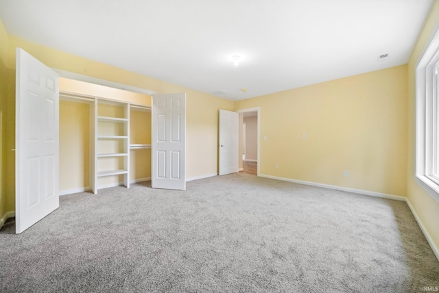 2416 S Woodland Trl, Warsaw, IN 46580 - unfurnished bedroom featuring carpet and baseboards