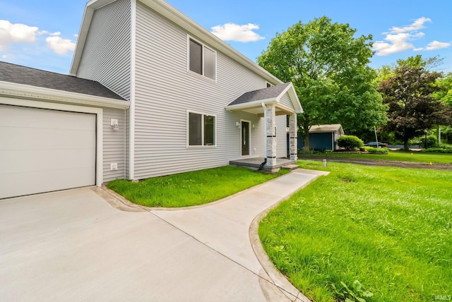 2416 S Woodland Trl, Warsaw, IN 46580 - view of front of house featuring a front yard, driveway, and an attached garage