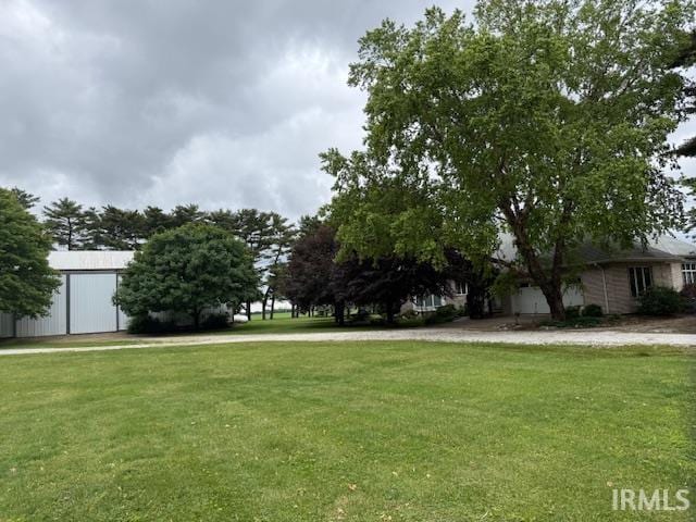 10872 N 875 E, Otterbein, IN 47970 - view of green lawn with an outbuilding and an outdoor structure