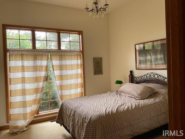10872 N 875 E, Otterbein, IN 47970 - bedroom featuring a chandelier and multiple windows