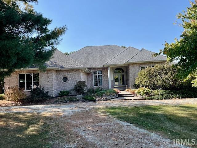 10872 N 875 E, Otterbein, IN 47970 - view of front of home with brick siding and french doors