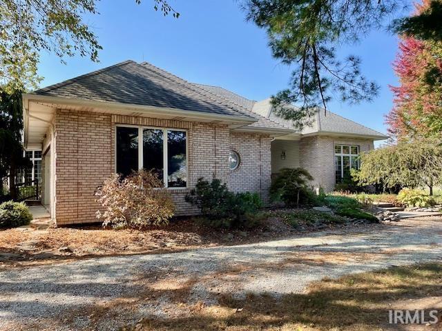 10872 N 875 E, Otterbein, IN 47970 - view of front of home featuring brick siding and a shingled roof
