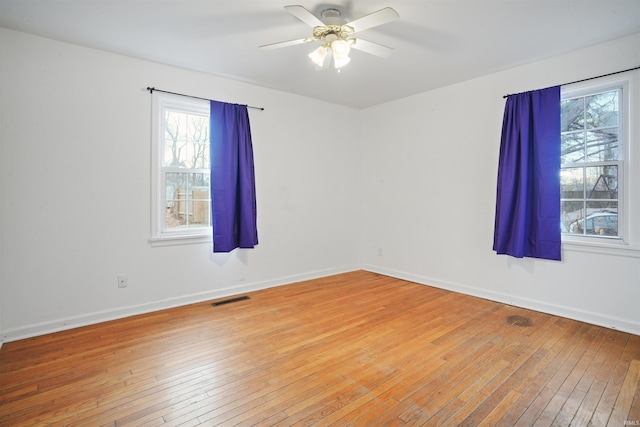 123 S Race St, Princeton, IN 47670 - empty room with light wood-style floors, plenty of natural light, a ceiling fan, and baseboards