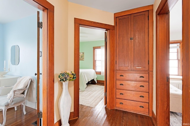 4325 S Wayne Ave, Fort Wayne, IN 46807 - hallway with dark wood-type flooring and baseboards