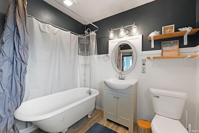 4325 S Wayne Ave, Fort Wayne, IN 46807 - bathroom with wood finished floors, vanity, toilet, and shower / tub combo with curtain