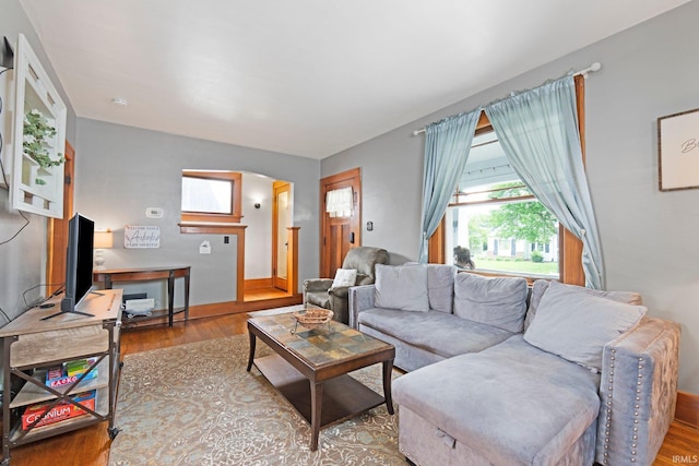 4325 S Wayne Ave, Fort Wayne, IN 46807 - living room featuring wood finished floors, baseboards, and arched walkways