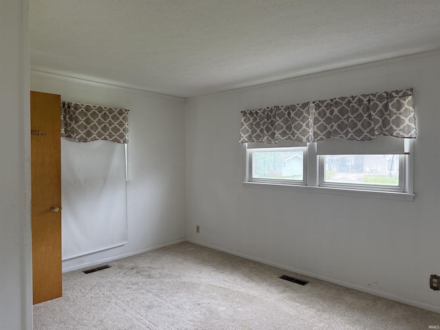 205 Riley Blvd, Bedford, IN 47421 - carpeted empty room with ornamental molding and a textured ceiling