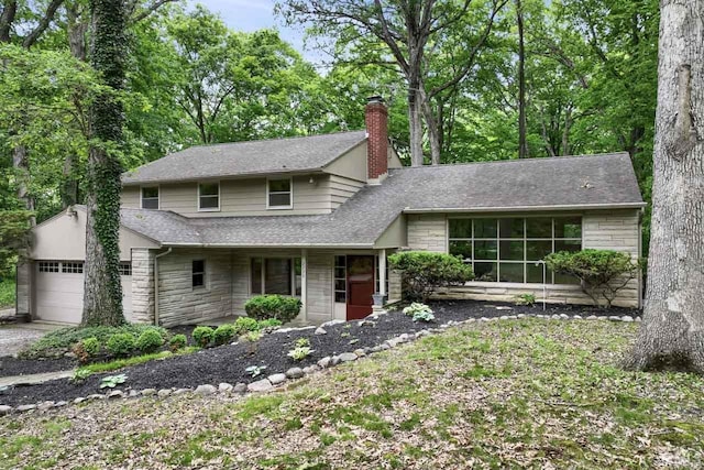2730 Newman Rd, West Lafayette, IN 47906 - view of front of property featuring stone siding, a chimney, and roof with shingles