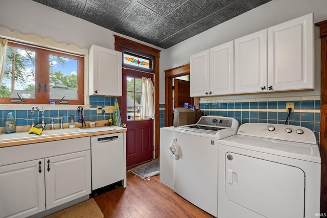 1824 Maple St, Lafayette, IN 47904 - laundry room with washing machine and dryer, a sink, wood finished floors, and an ornate ceiling