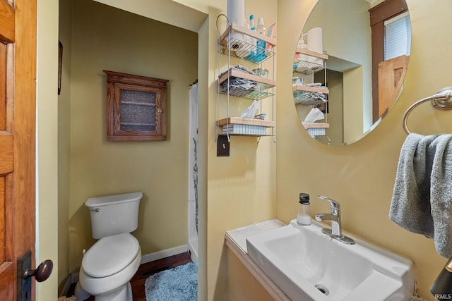 1824 Maple St, Lafayette, IN 47904 - full bath featuring toilet, a shower with curtain, vanity, and baseboards