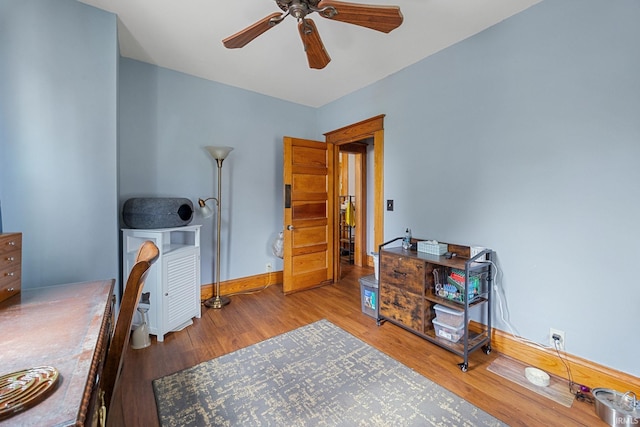 1824 Maple St, Lafayette, IN 47904 - bedroom featuring wood finished floors, a desk, baseboards, and a ceiling fan