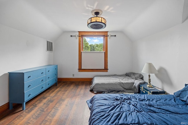 1824 Maple St, Lafayette, IN 47904 - bedroom with lofted ceiling, dark wood-type flooring, and baseboards