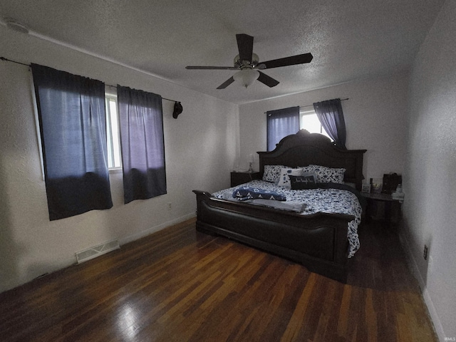2038 Shaw Ave, Peru, IN 46970 - bedroom with wood finished floors, baseboards, ceiling fan, and a textured ceiling