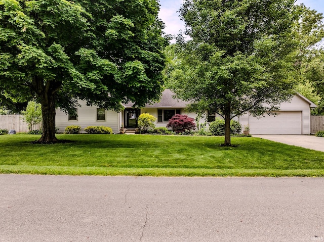 6607 W Ryan Dr, Anderson, IN 46011 - obstructed view of property with concrete driveway and an attached garage