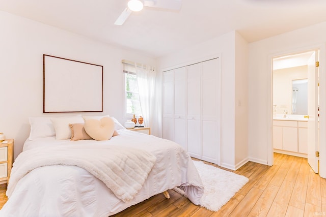 6607 W Ryan Dr, Anderson, IN 46011 - bedroom featuring a closet, light wood-style floors, baseboards, and ceiling fan