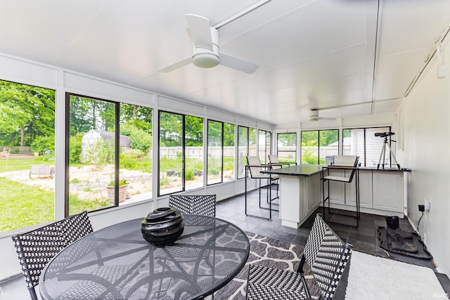 6607 W Ryan Dr, Anderson, IN 46011 - sunroom / solarium featuring a ceiling fan, outdoor dining area, and an outdoor bar