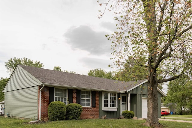 1708 Mason Dixon Dr, West Lafayette, IN 47906 - single story home with an attached garage, brick siding, a front yard, and a shingled roof