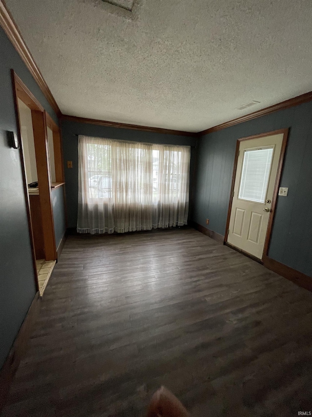 2724 Elva Dr, Kokomo, IN 46902 - unfurnished living room with ornamental molding, a textured ceiling, wood finished floors, and baseboards