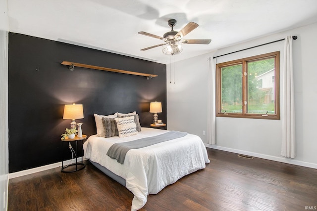 1453 Brookview Ave, Warsaw, IN 46580 - bedroom with wood finished floors, baseboards, and a ceiling fan