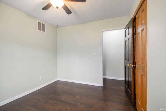 1453 Brookview Ave, Warsaw, IN 46580 - unfurnished bedroom with dark wood-style flooring, baseboards, and a ceiling fan